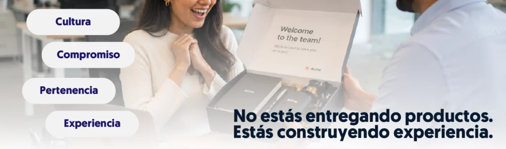 una persona entregándole a otra un pack de bienvenida y eso hace que esa persona se sorprenda